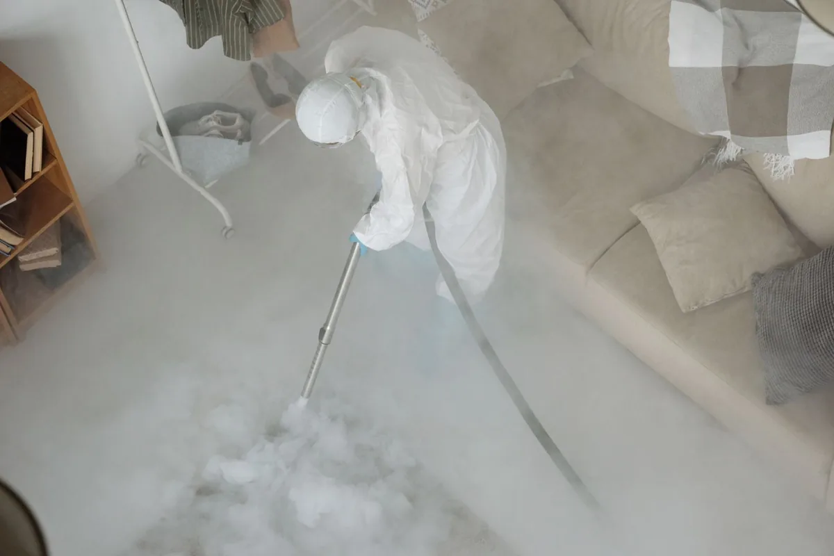 Biohazard cleanup technician in protective equipment, Salem, AR